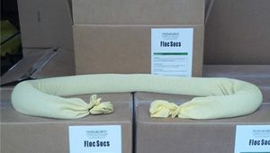 A box of yellow floe socks in front of boxes.